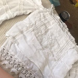 a guess kinda off the shoulder white long sleeve